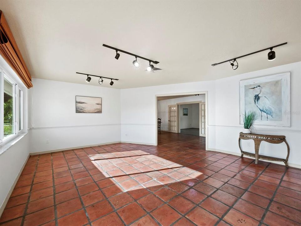 Step inside to this large, light filled front room with warm Saltillo tile.