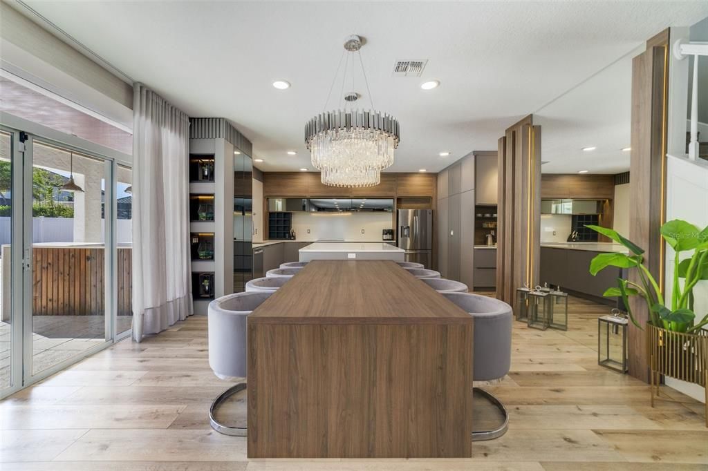 Take some time to explore the exceptional kitchen where sleek modern cabinetry is paired with stone counters, upgraded stainless steel appliances, endless storage and some fun ‘hidden’ features.