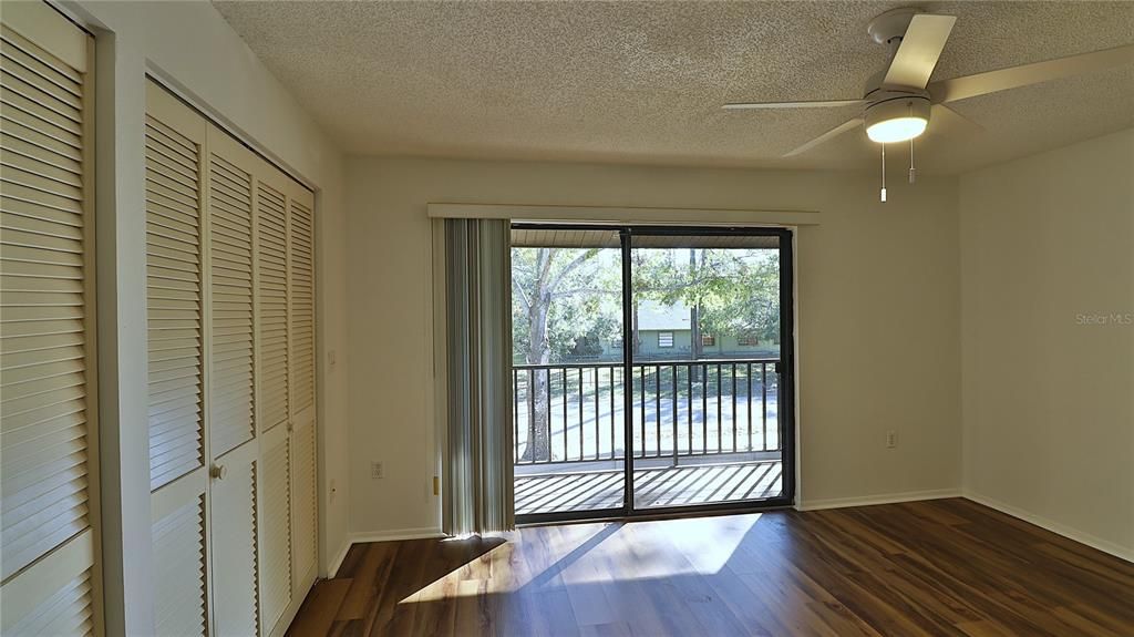 Guest bedroom. Note the big closet and the balcony.