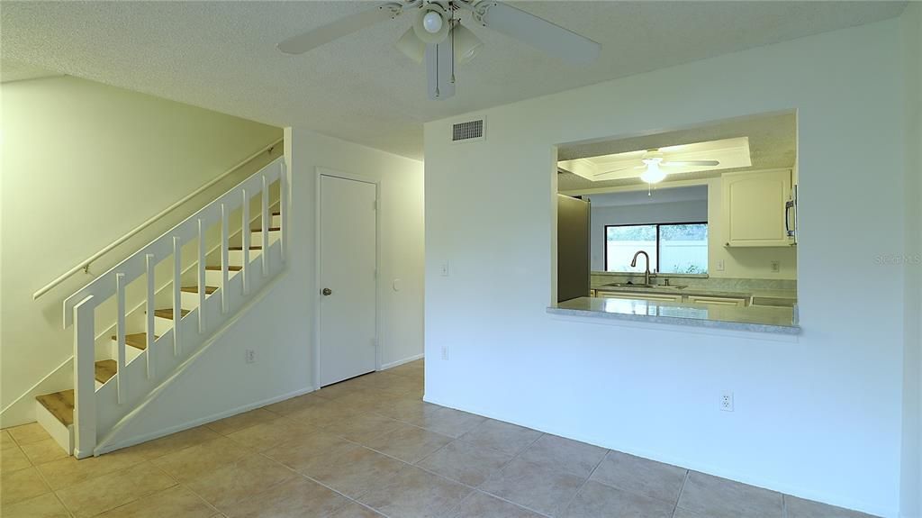 The kitchen has a convenient opening to the dining room.