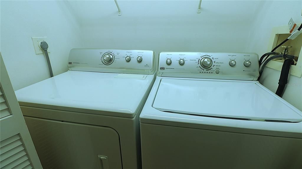 The Maytag washer and dryer are inside a closet in the hallway connecting the two bedrooms.