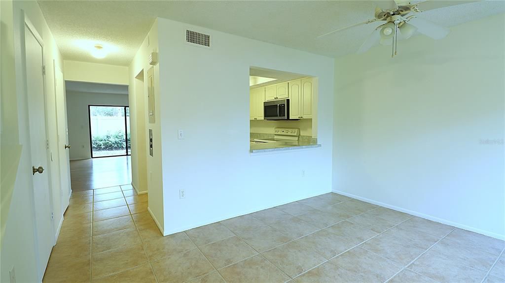 Hallway to entrance of the kitchen, half bath, and li ing room