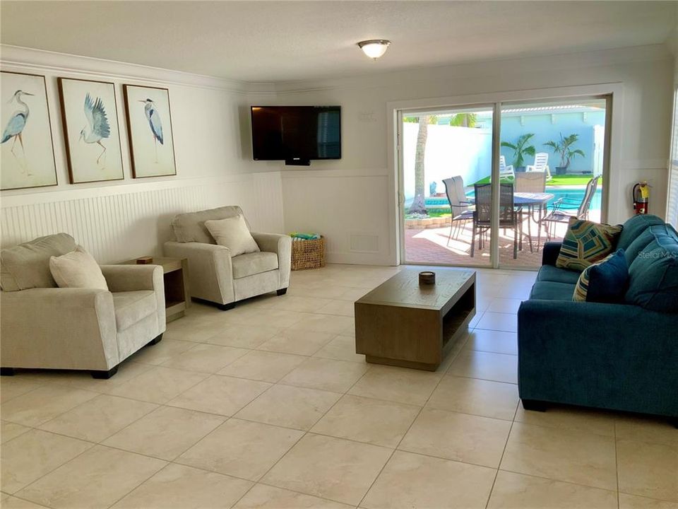 ground floor family room leading to the BBQ, Pool and Hot tub