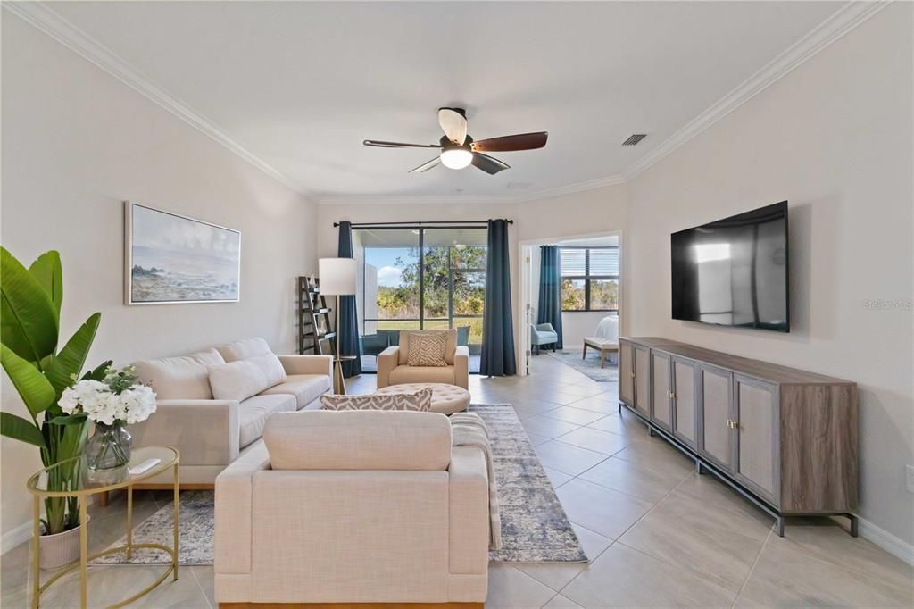 Spacious living room with sliders leading out to the lanai