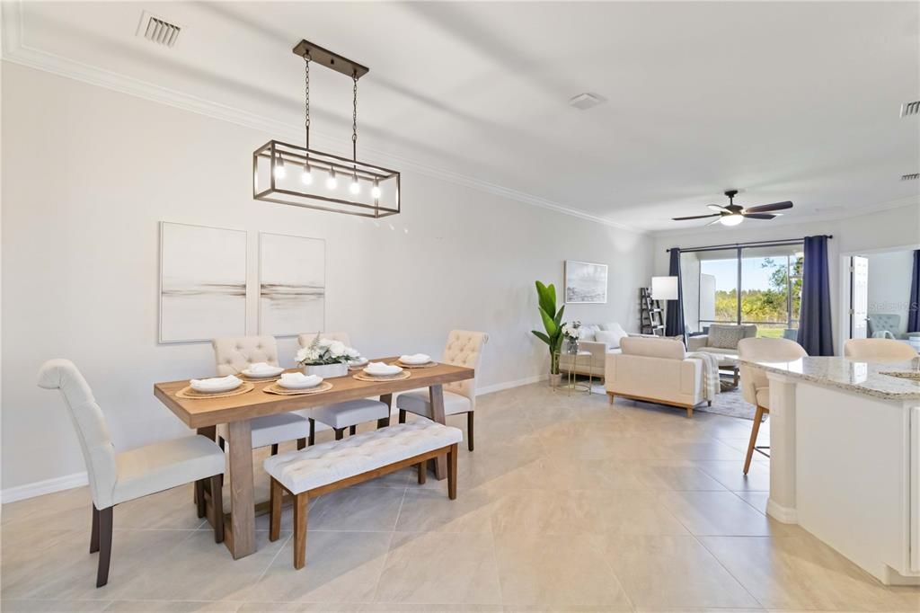 Dedicated dining area with upgraded light fixtures and ceiling fans