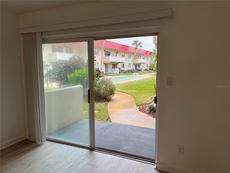 Sliding Glass Doors leading out to the Back Porch