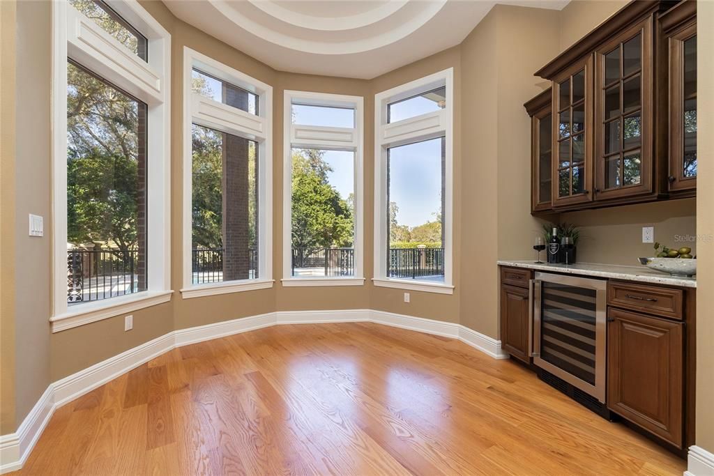 Breakfast room overlooks pool and golf course