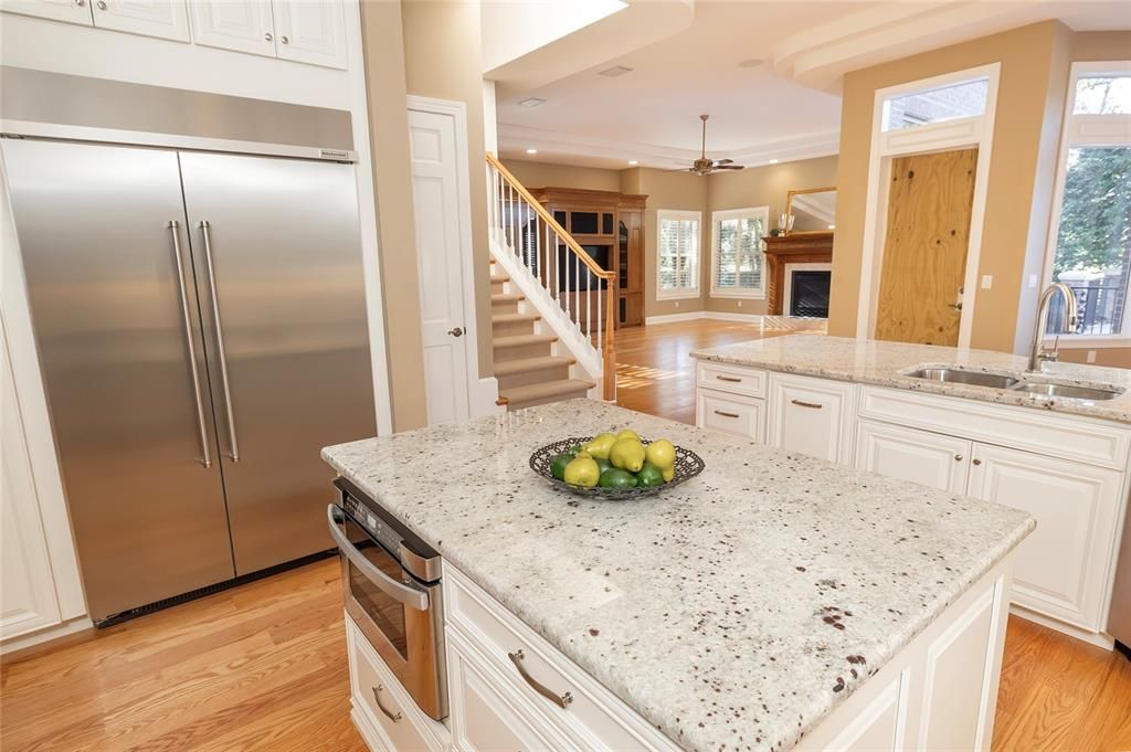 Kitchen opens to breakfast room and family room