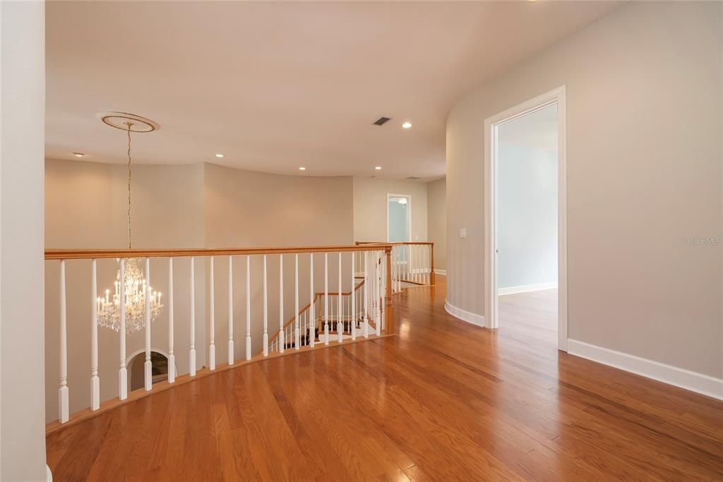 Landing for the upstairs bedroom suites - this loft area is just outside guest bedroom 2 & 3.  A laundry chute provides convenient access to first floor laundry room.