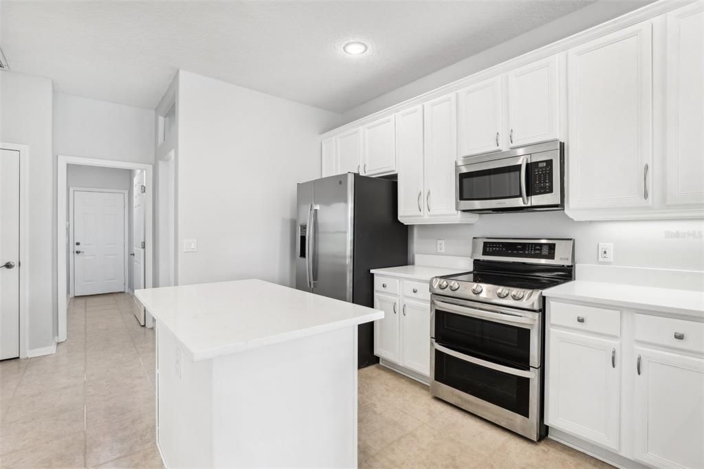 The home chef will appreciate the completely UPDATED KITCHEN offering a great mix of cabinet and drawer storage, QUARTZ COUNTERTOPS, STAINLESS STEEL APPLIANCES, CENTER ISLAND, ample storage and the breakfast nook provides casual dining with a view of the water!