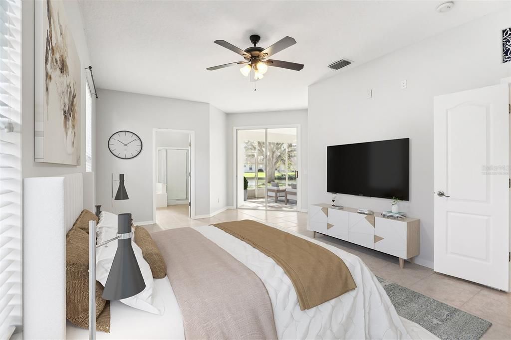 The owner’s suite is another bright space with its own access to the lanai, oversized WALK-IN CLOSET and a well appointed en-suite bath complete with a dual sink vanity, SOAKING TUB and separate glass enclosed shower. Virtually Staged.