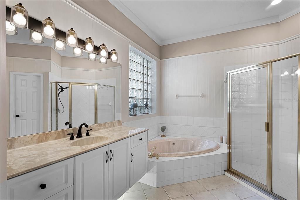 Primary Bathroom with Dual Sink and Whirlpool Bath