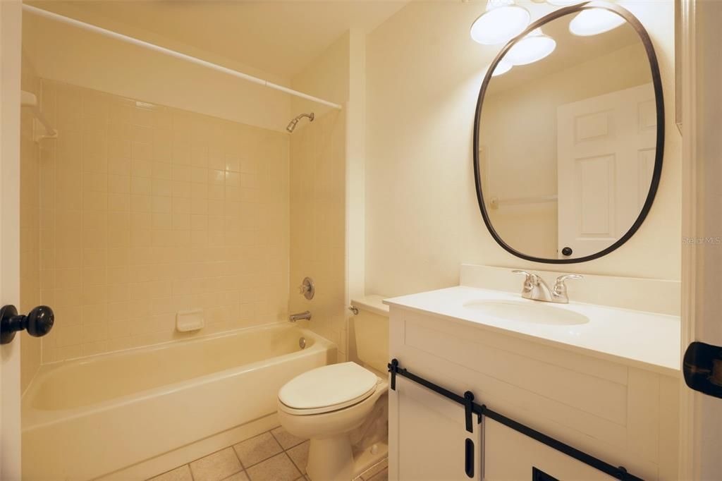 Guest bath includes new vanity and fixtures.