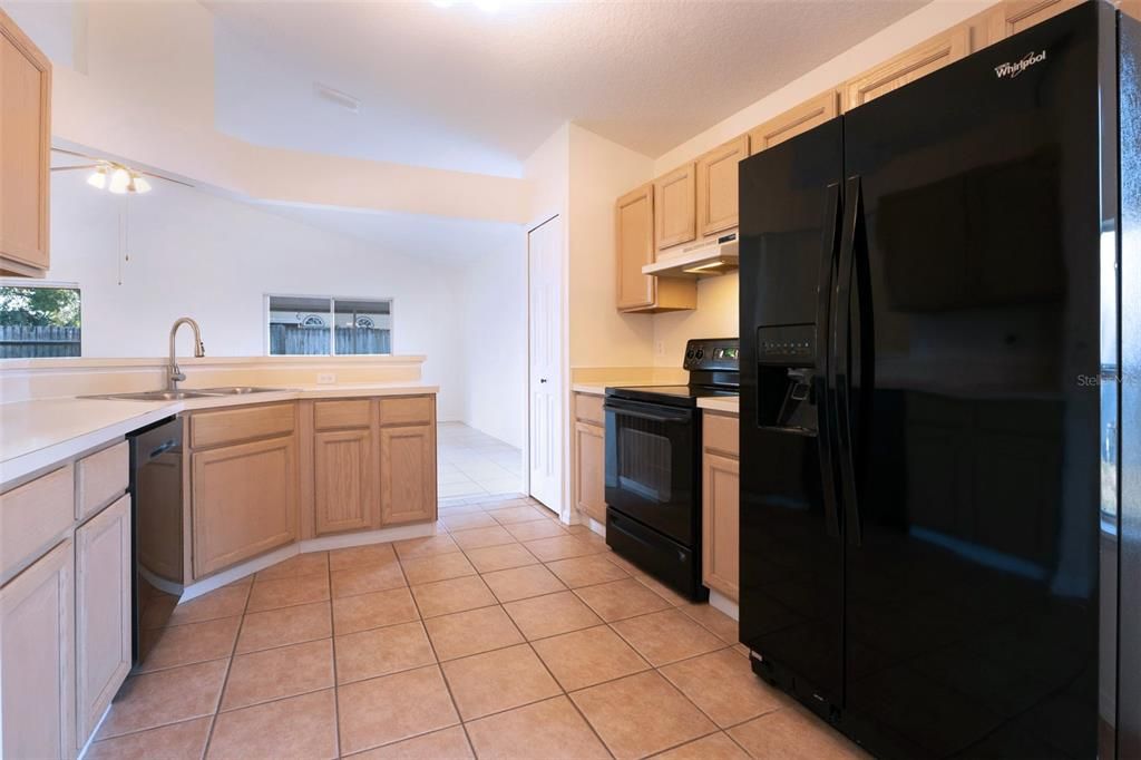 The large kitchen includes all appliances (dishwasher is newer).