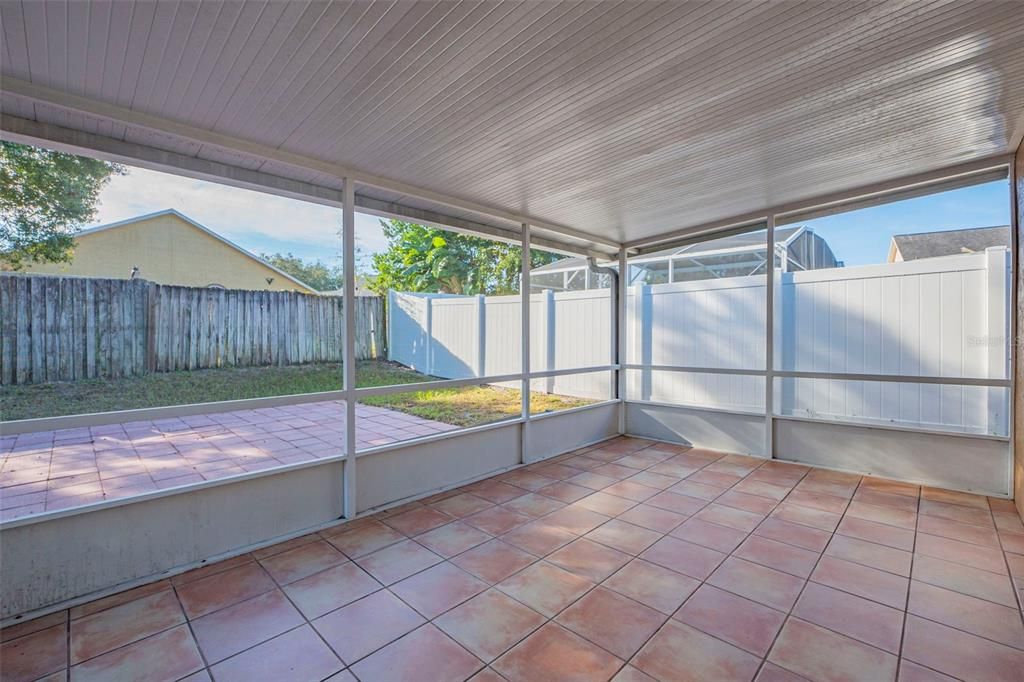 Screened rear porch.