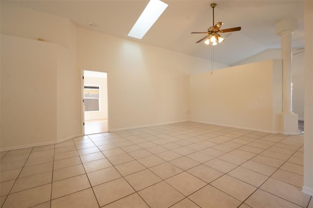 The main living area features soaring ceilings and plenty of natural lighting.