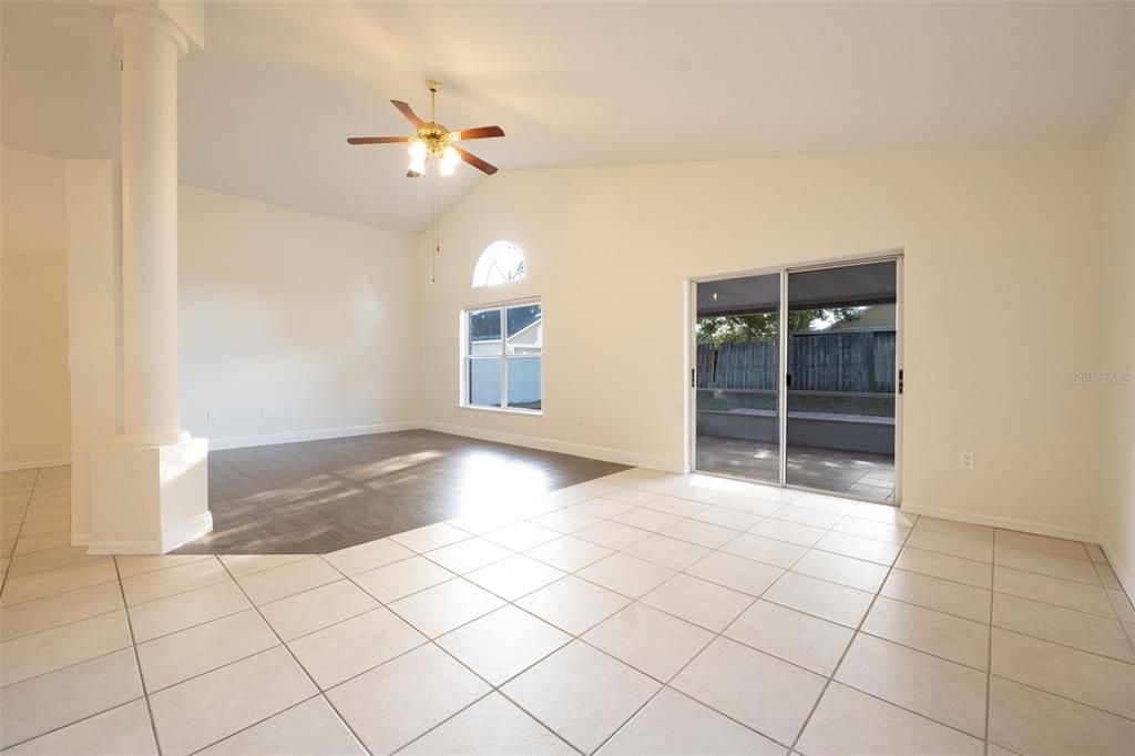 Dining area towards rear living area and screened porch to back yard.