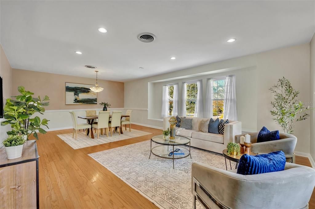 Virtually Staged - Living /Dining Room featuring 3 windows for an array of natural light.