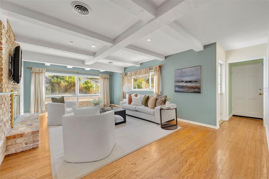 Virtually Staged- Family Room with Floor to Ceiling Windows and Soaring Beams