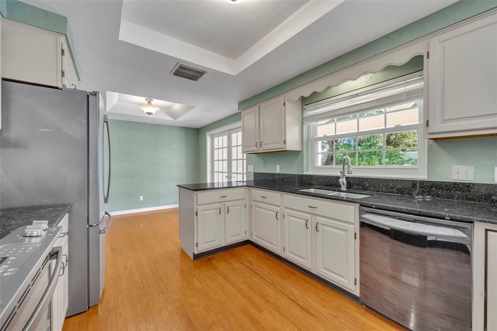 Kitchen with spacious window overlooking the pool area