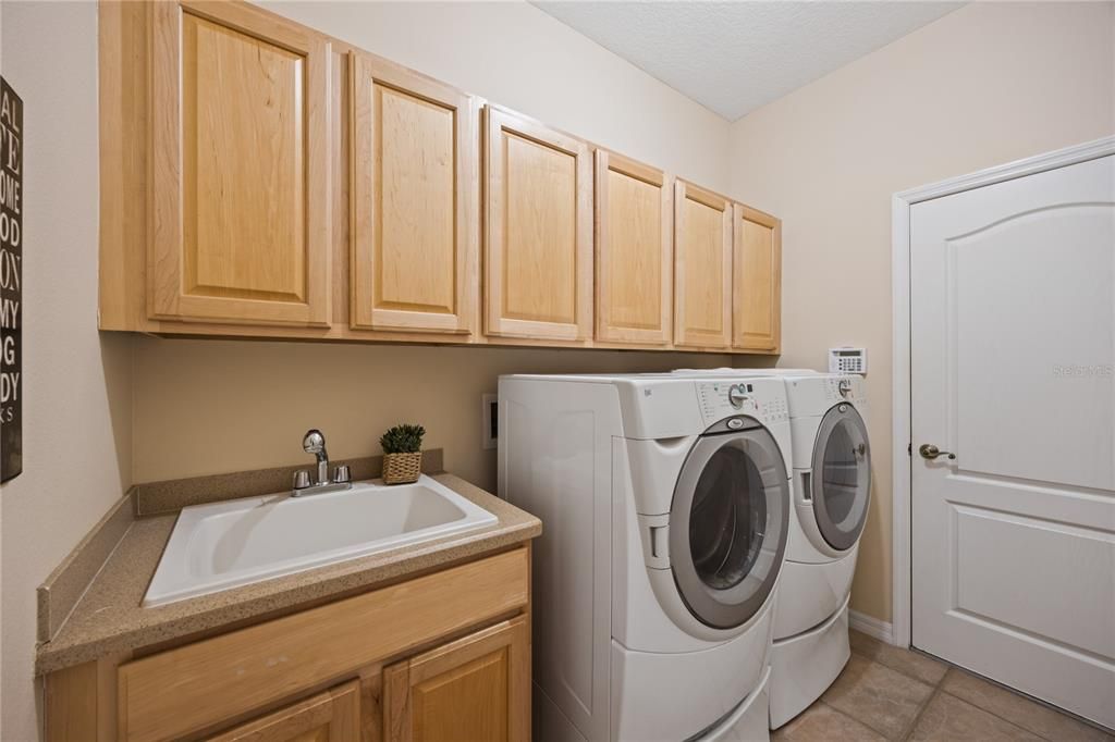 indoor laundry connected to kitchen and garage