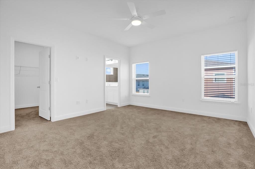 Primary bedroom with walk in closet