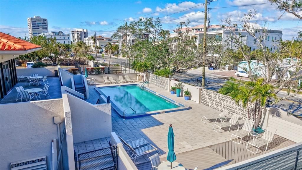 View of community pool adjacent to clubhouse