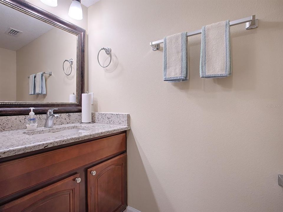 Downstairs powder room with granite countertops