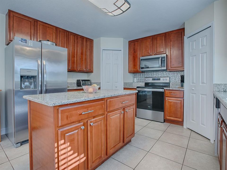 Loads of cabinetry and counter space for meal prep.  Two pantries!