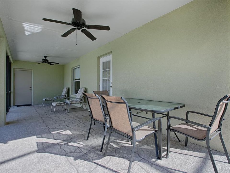 Covered lanai with access door to the Living room