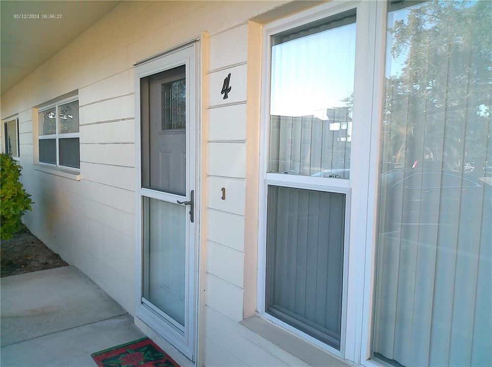 Newer double paned windows and storm door for energy efficiency.