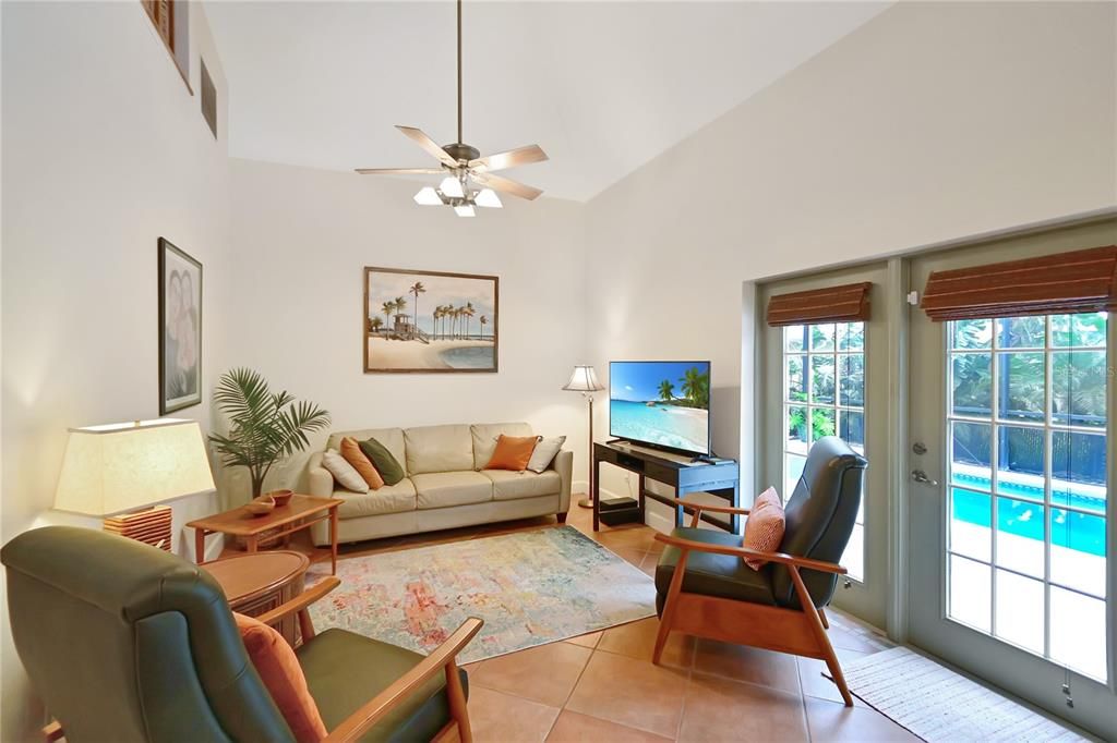 French doors lead out to pool and patio