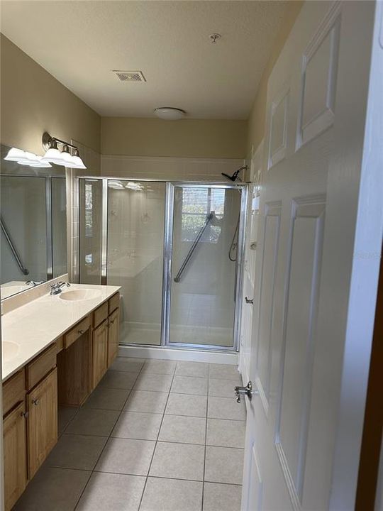 Bath suite has water closet, linen closet and an ample sized walk-in closet (behind door)