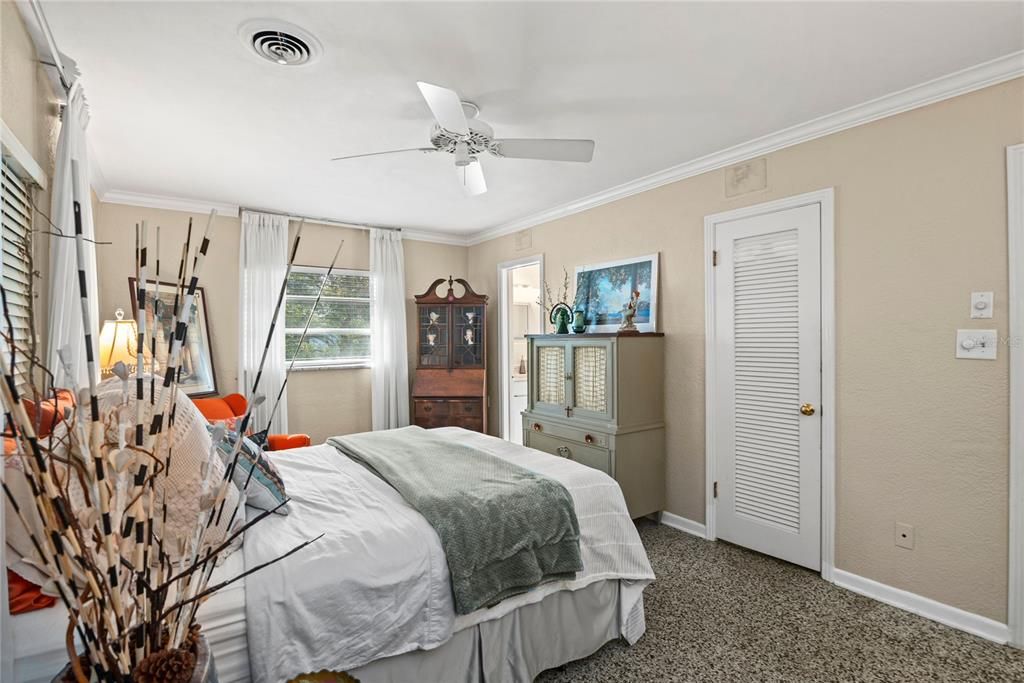 Primary bedroom with walk-in closet and en suite bathroom