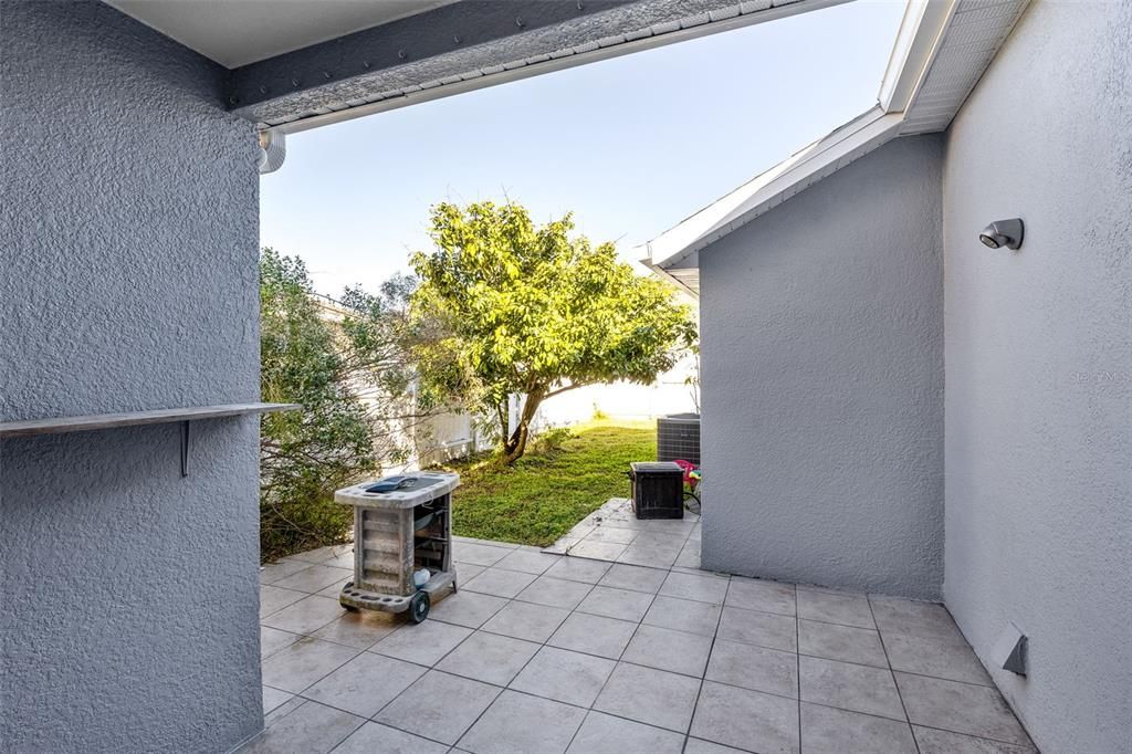 Covered Back Patio showing back yard and fence