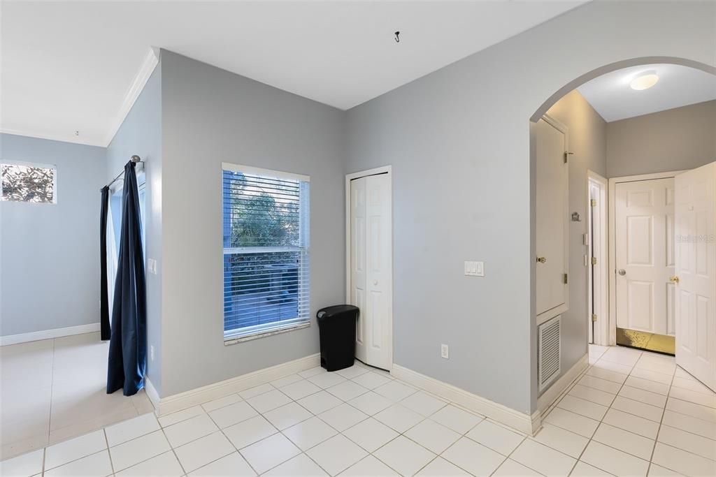 Downstairs Leading to Laundry, Guest Bathroom, and Garage