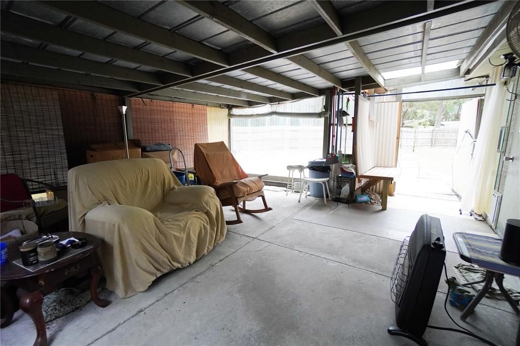 Spacious Carport next to the house and connects to a garage nearest the house.