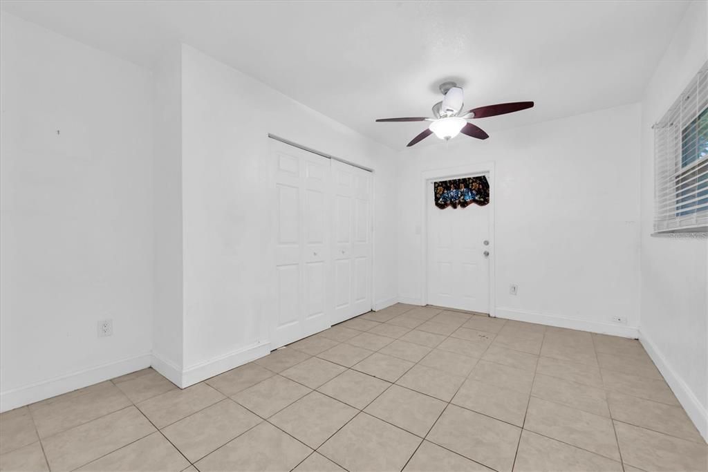 Second bedroom with its own outside entrance.  This leads to many possibilities such as a rented bedroom for cash flow, or another office space or live here and work next door!  No work commute!