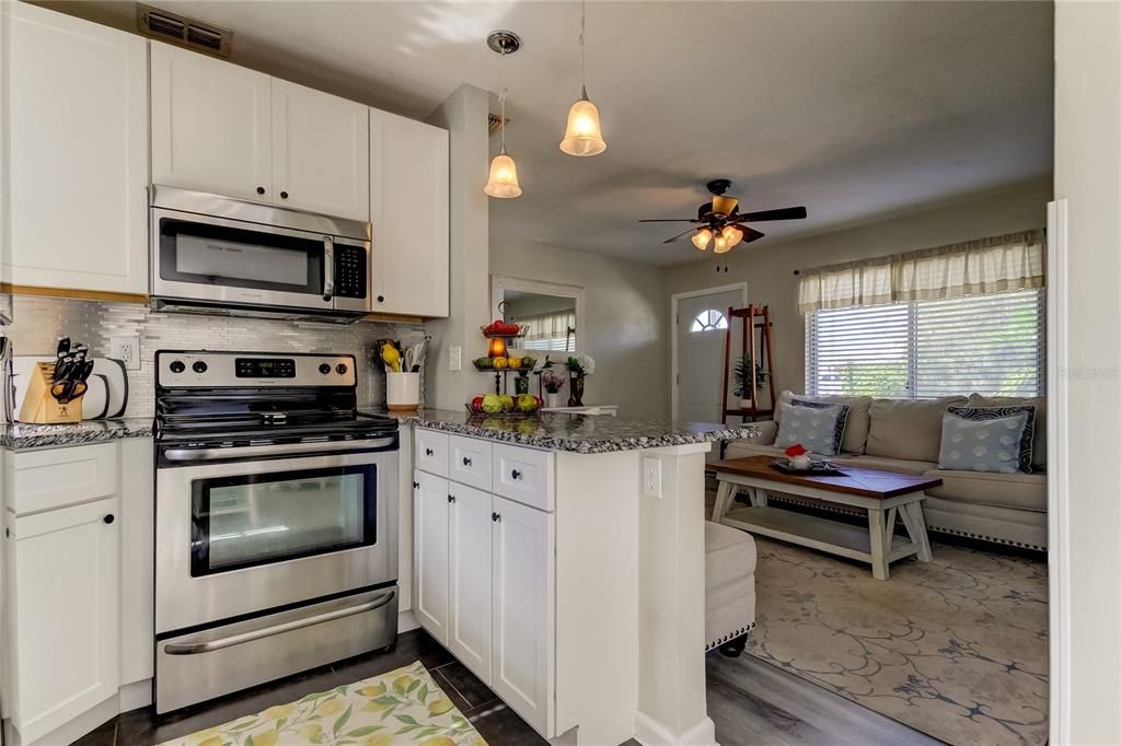 Kitchen has been updated with granite counters & stainless appliances