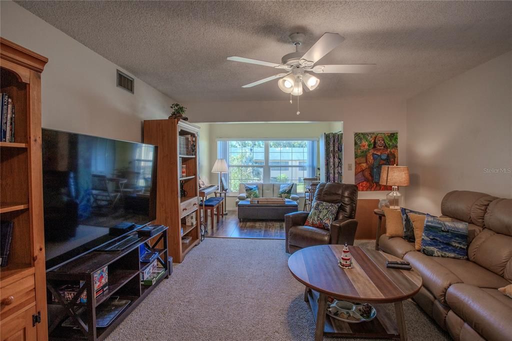 Living room looking into den/bonus room