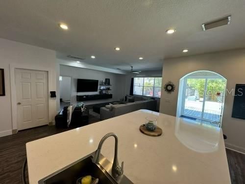 Huge kitchen Island with custom sink and breakfast bar / seating for all!