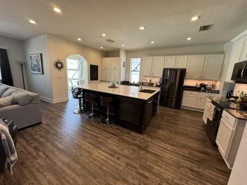 Huge kitchen Island with custom sink and breakfast bar / seating for all!