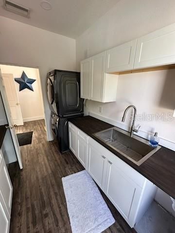 Huge laundry room with custom sink/cabinets!