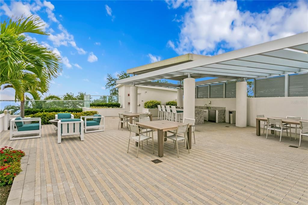 Loads of outdoor space for entertaining or simply relaxing, including a separate bar area with refrigeration, fire pits and tables for dining.