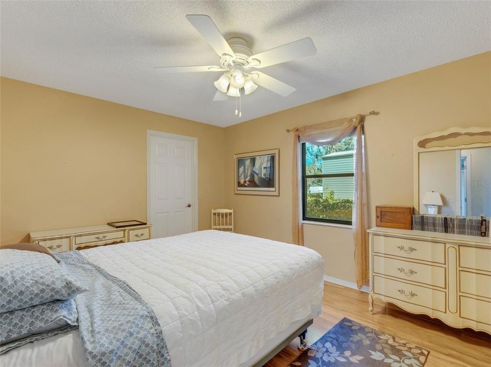 Bedroom #2 is generously proportioned with the same wood laminate flooring plus a walk-in closet.