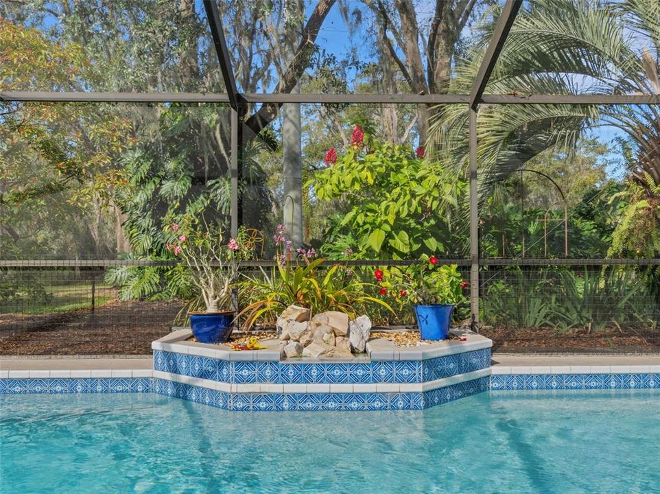 The stone waterfall feature and planter add a "Zen-like" quality to this entire area.