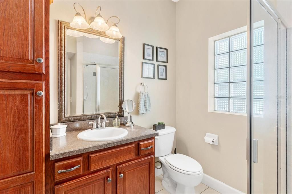 Primary bathroom features shower and walk in closet.