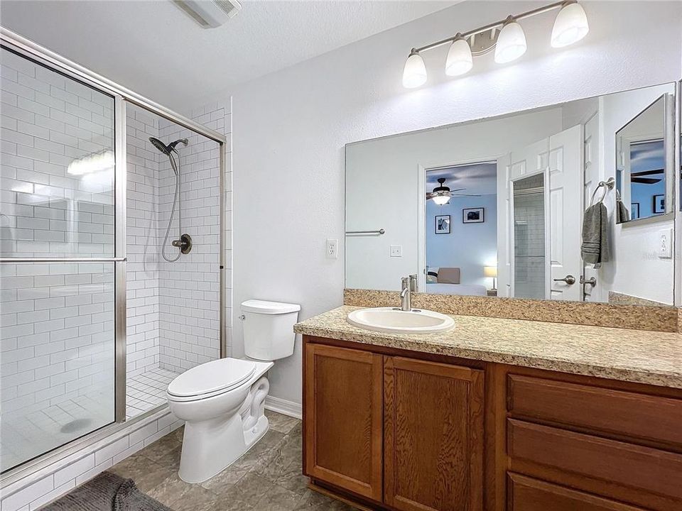 Updated Primary Bath features walk-in shower, extended Vanity and spacious linen closet.