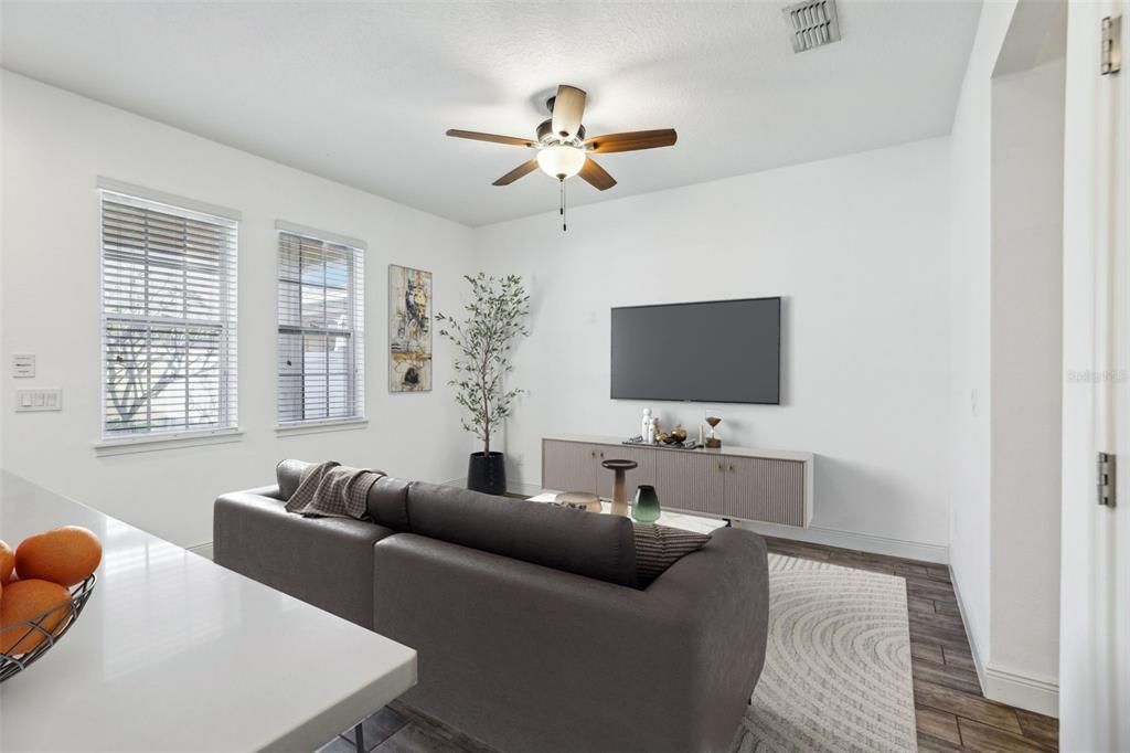 This BEAUTIFUL TOWNHOME is the EPITOME of AFFORDABLE LUXURY. LUXURIOUS UPGRADES INCLUDE: Porcelain Wood Look Tile throughout the downstairs, complemented by fresh interior paint, and a large kitchen that includes an oversized island, Corian Countertops, White Cabinets, Stainless Steel Appliances and Tile Backsplash!