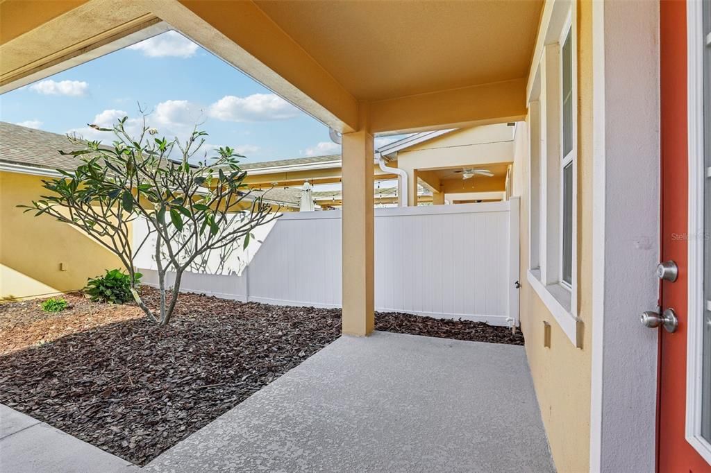 Private Patio and Backyard Space between the Main House and Attached Garage